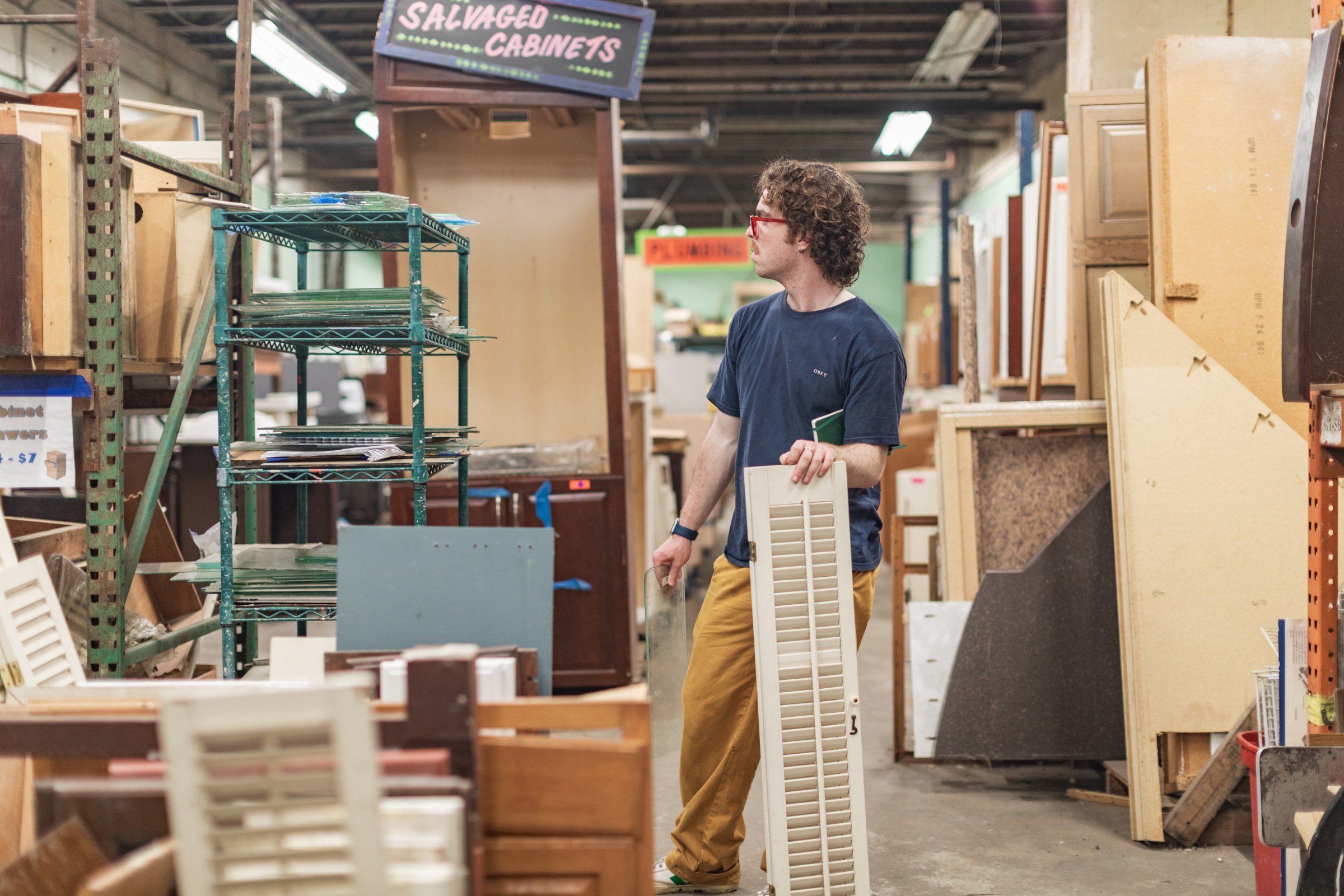 picture of student holding wood in woodshop