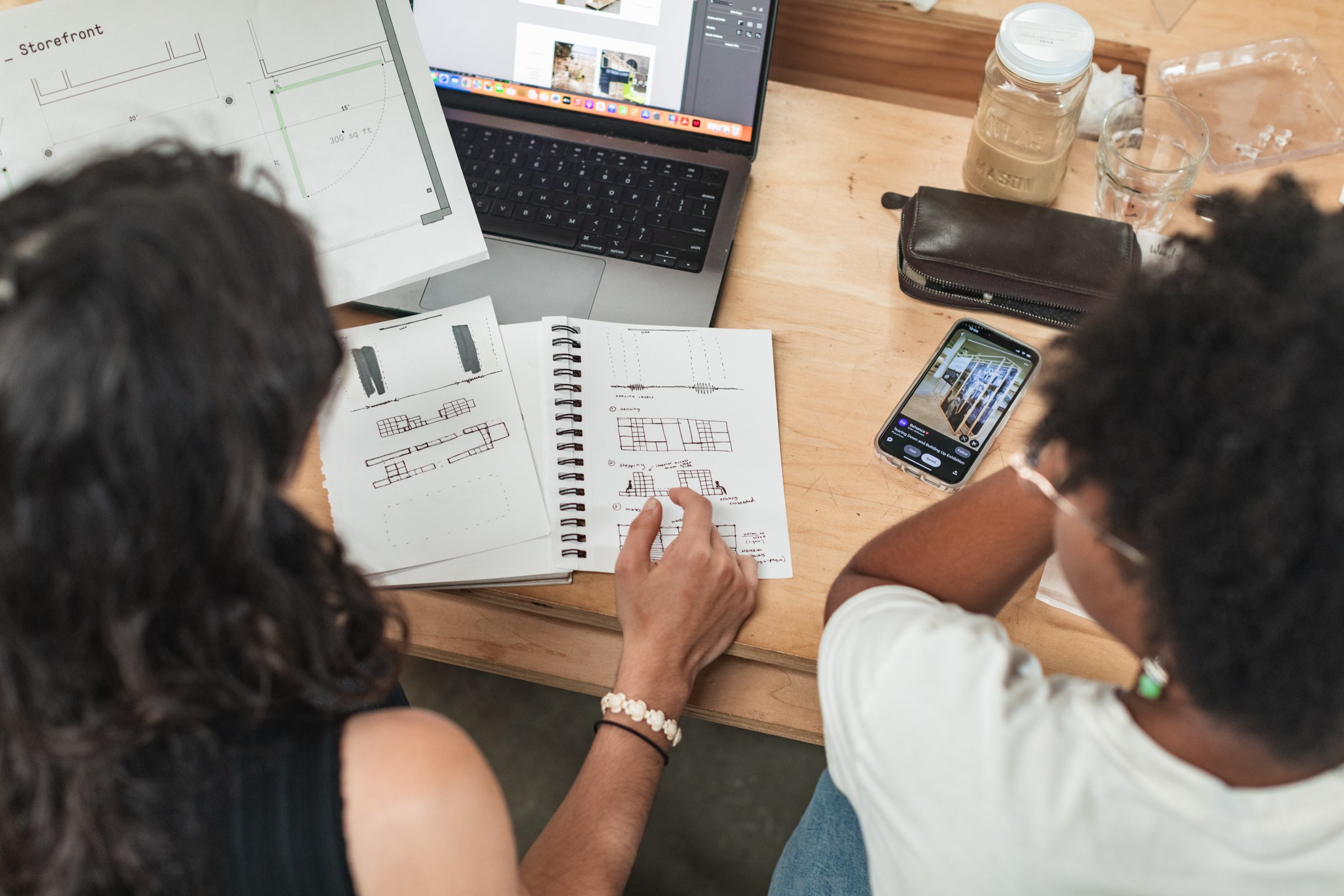 image of two students sketching out ideas