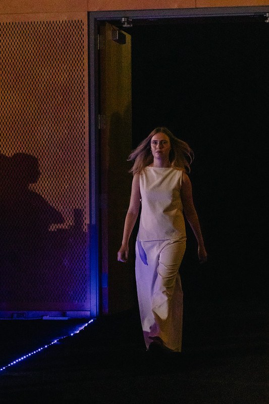 Women on runway wearing white dress