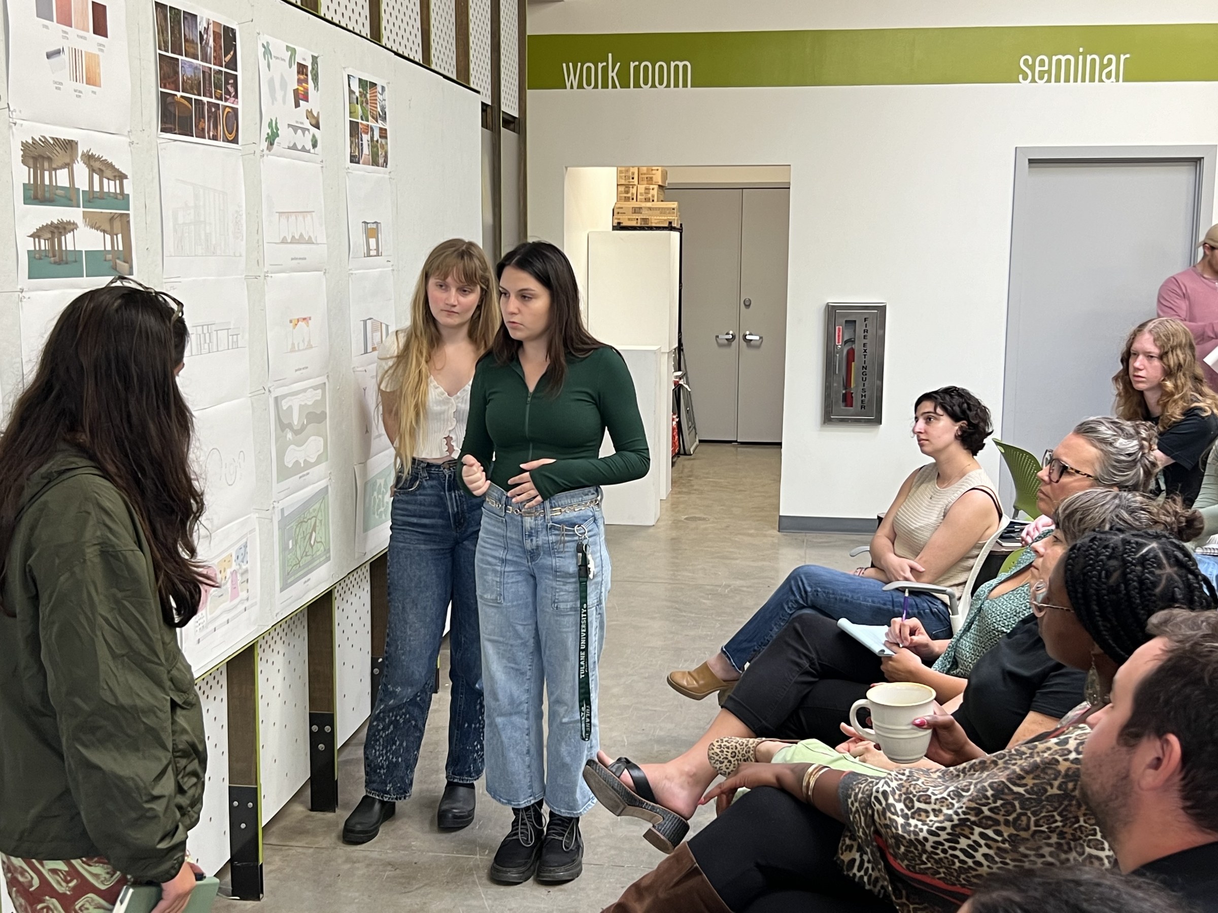 Students present their design proposals for Sprout House to Sprout partners.