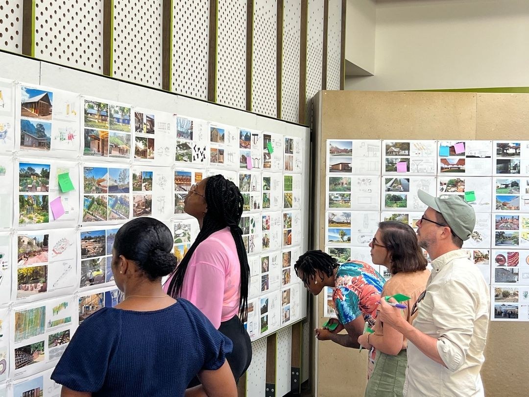 Students present their design proposals for Sprout House to Sprout partners.