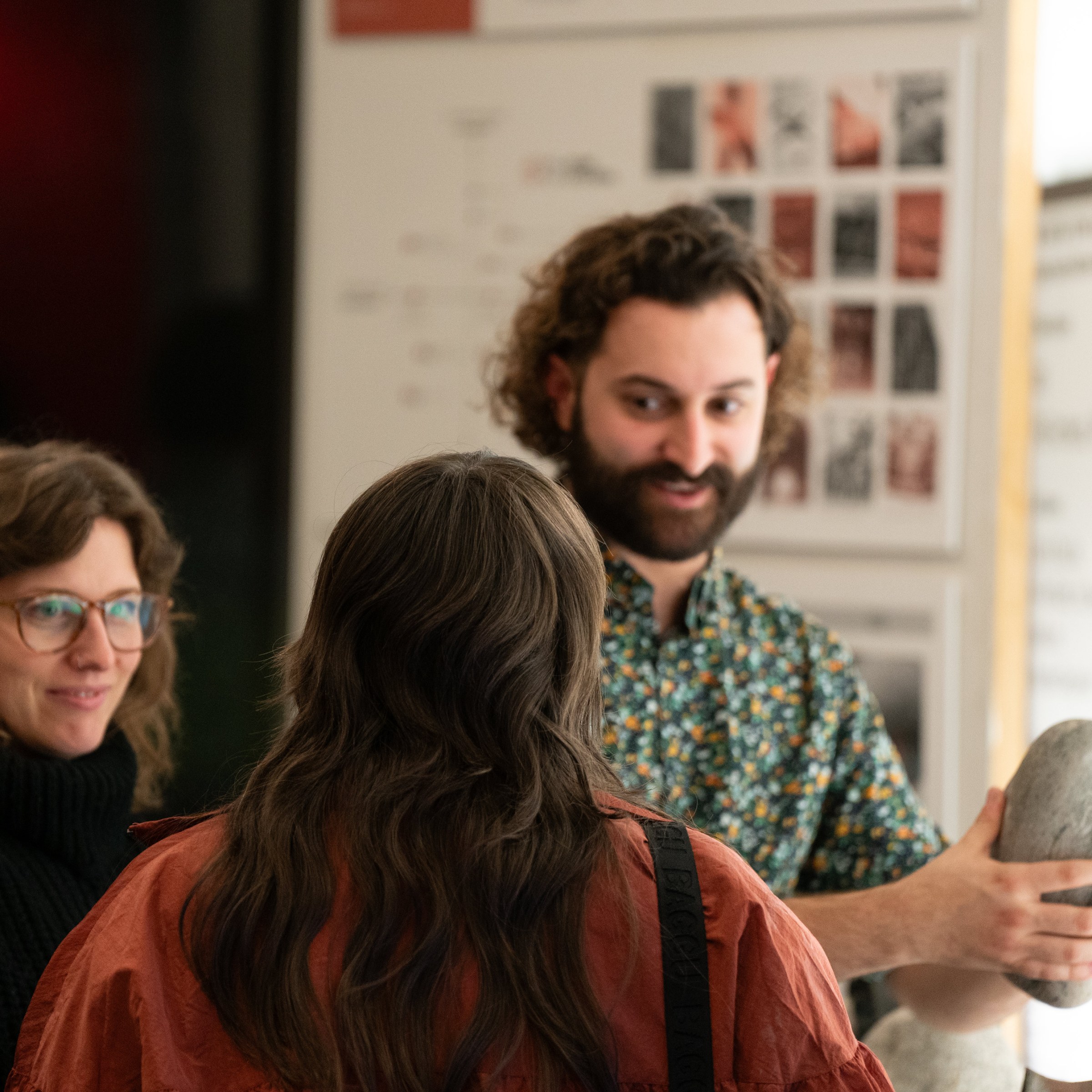 image of an open house, people paying attention to person talking