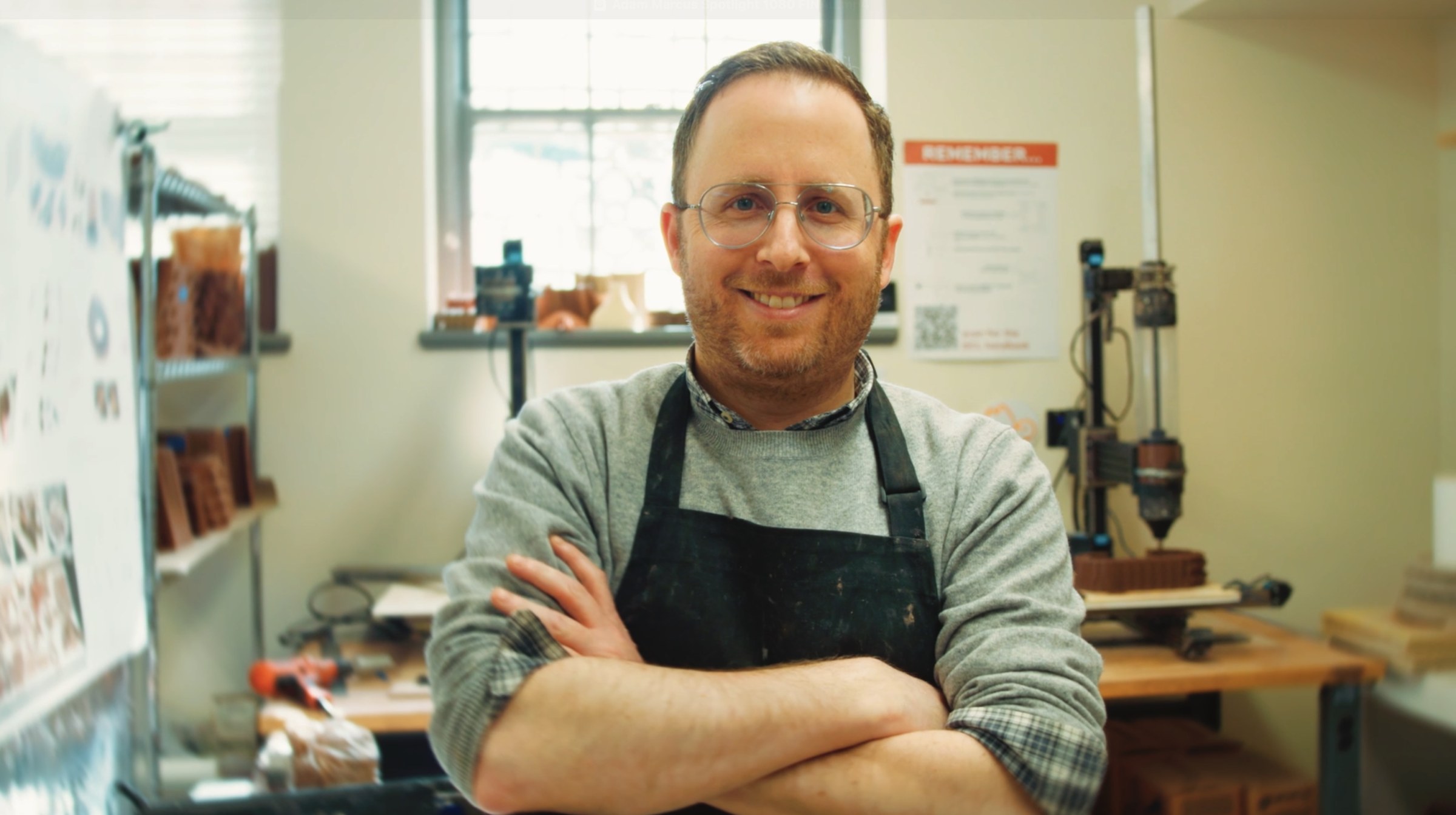 Environmental portrait of Adam Marcus in his ceramic 3D-printing lab.