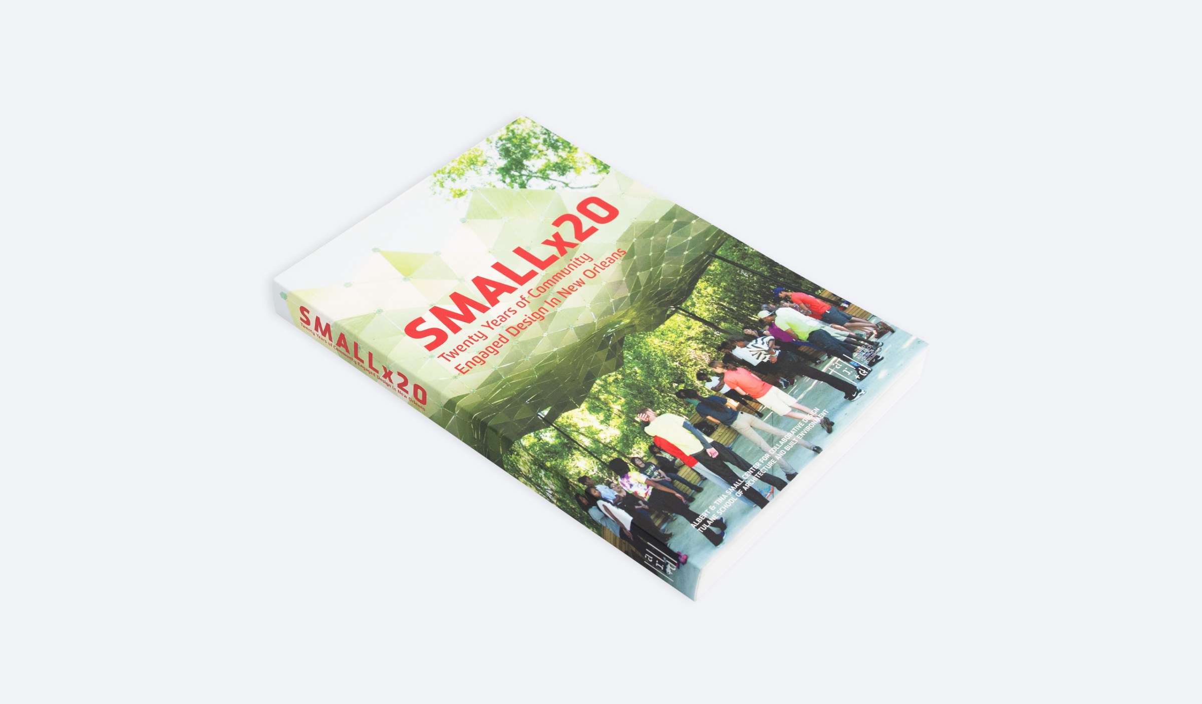 Angled view of the front cover of Small Center's book Smallx20, which focuses on its two decades of work.